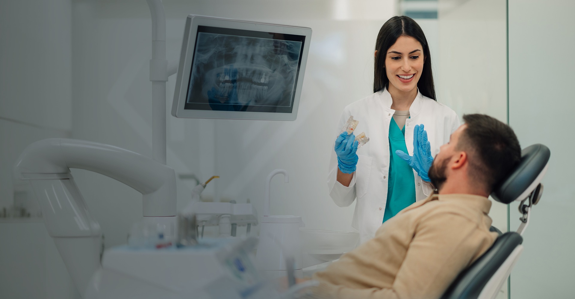 Dentist and patient at clinic talking