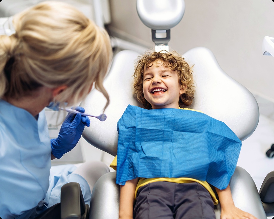 Young boy laughing dental clinic